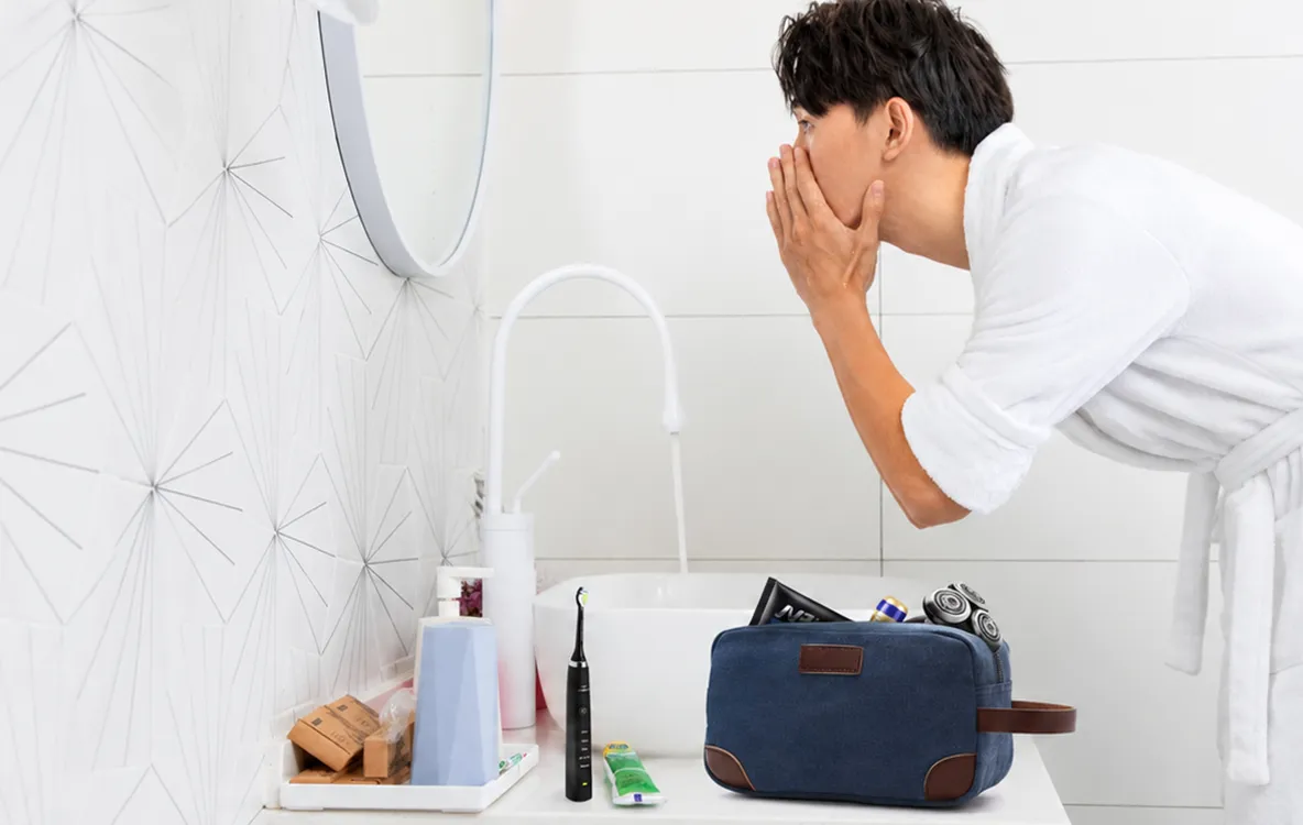 blue canvas toiletry bag bathroom scene